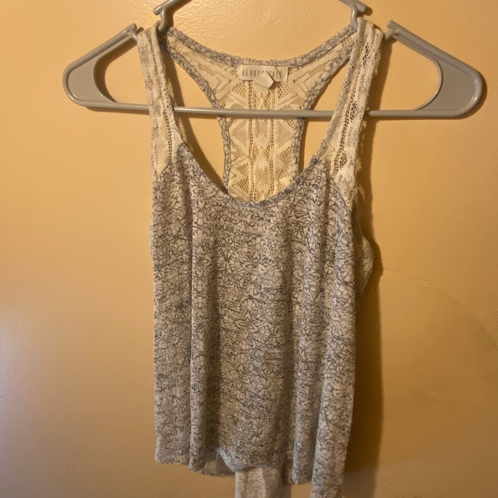XS tank top but fits me and I wear medium